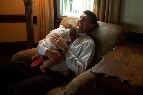 Kevin looks very comfortable with that baby too!  Corry is in a lot of trouble!