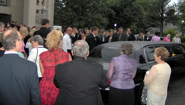 The new husband and wife enter their limo!