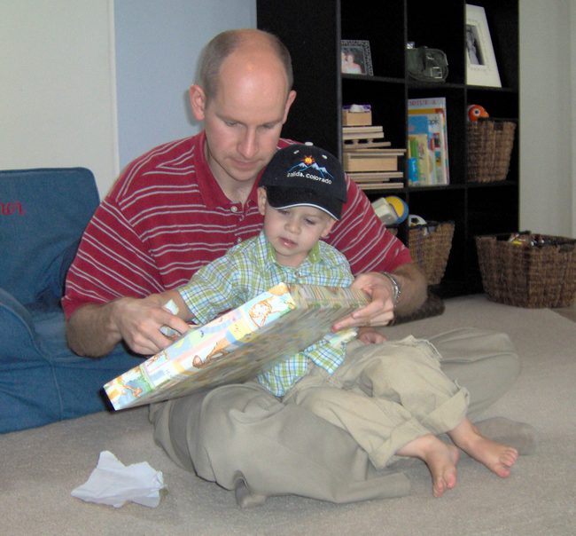 Ben helping Connor open his present from us!