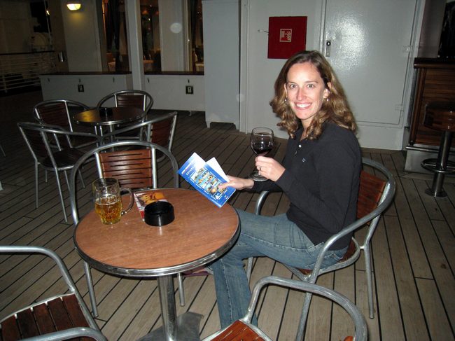 Jen cheers up after learning that they are going to give us open bar until they can get us where we need to go!