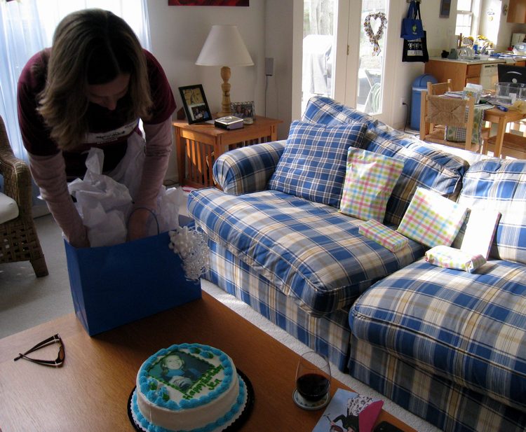 Jen starts digging in the gifts!